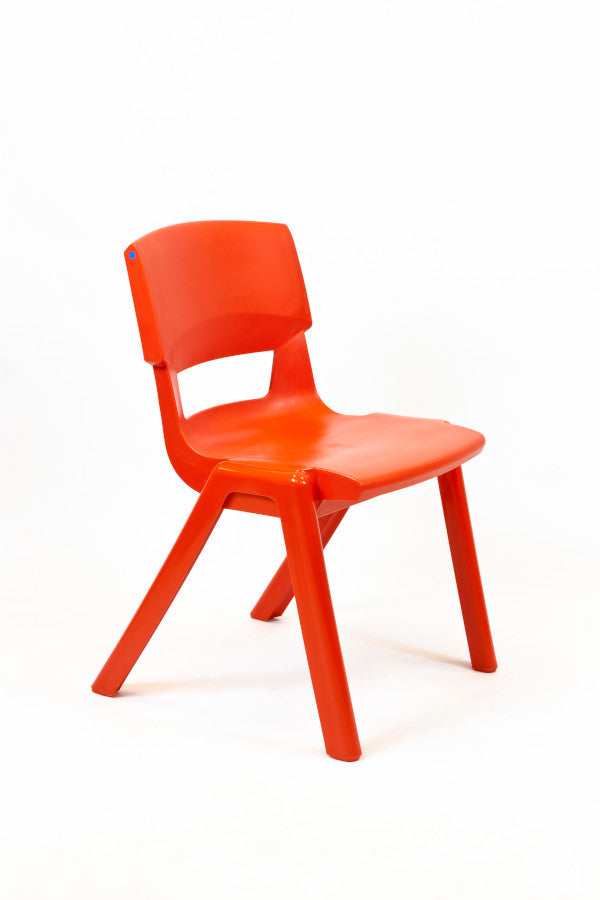 A bright orange poppy red one piece plastic chair with a waterfall seat edge, designed for educational or classroom use.
