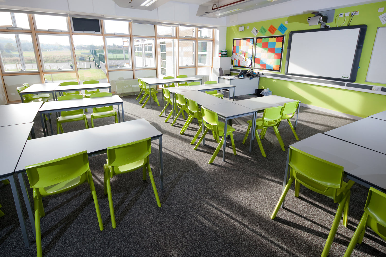 green one piece chairs in a pleckgate high school classroom